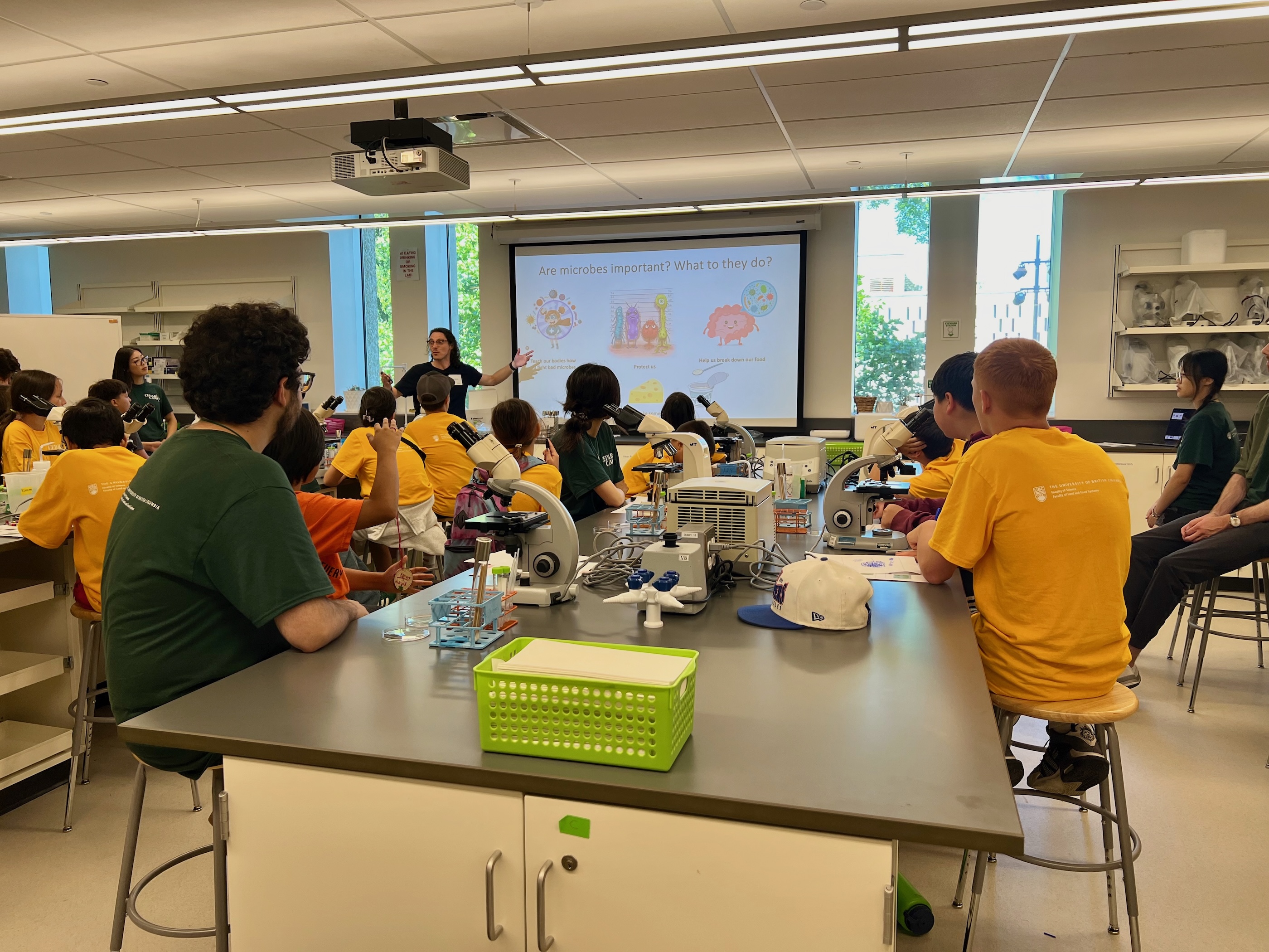 A teacher talking in front of a classroom full of students