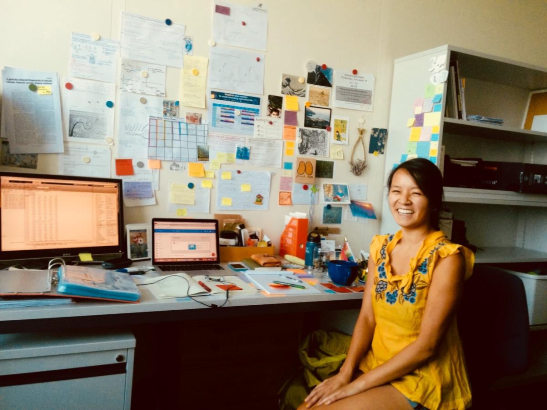 Jen Nguyen at a desk 